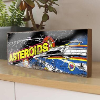 Capture the thrill of the arcade with our "Asteroids" Retro Game Sign. This nostalgic piece features the iconic artwork from the classic arcade game Asteroids