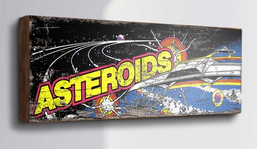 Capture the thrill of the arcade with our "Asteroids" Retro Game Sign. This nostalgic piece features the iconic artwork from the classic arcade game Asteroids