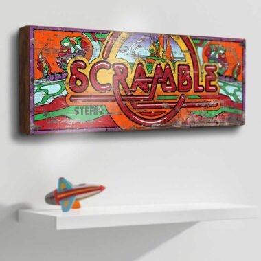 Features the vivid and intricate Scramble logo, showcasing the detailed artwork that defined the arcade experience.